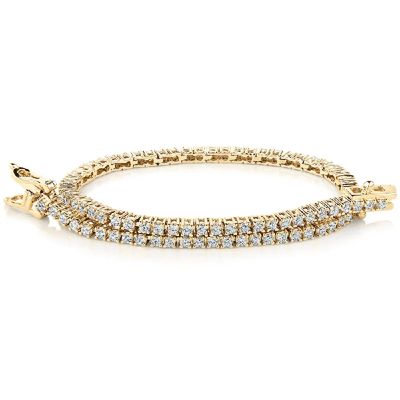 Ladies bracelets for wild vibes -Round Brilliant tennis bracelet with 1.29 carats* of diamond simulants in 10 carat yellow gold