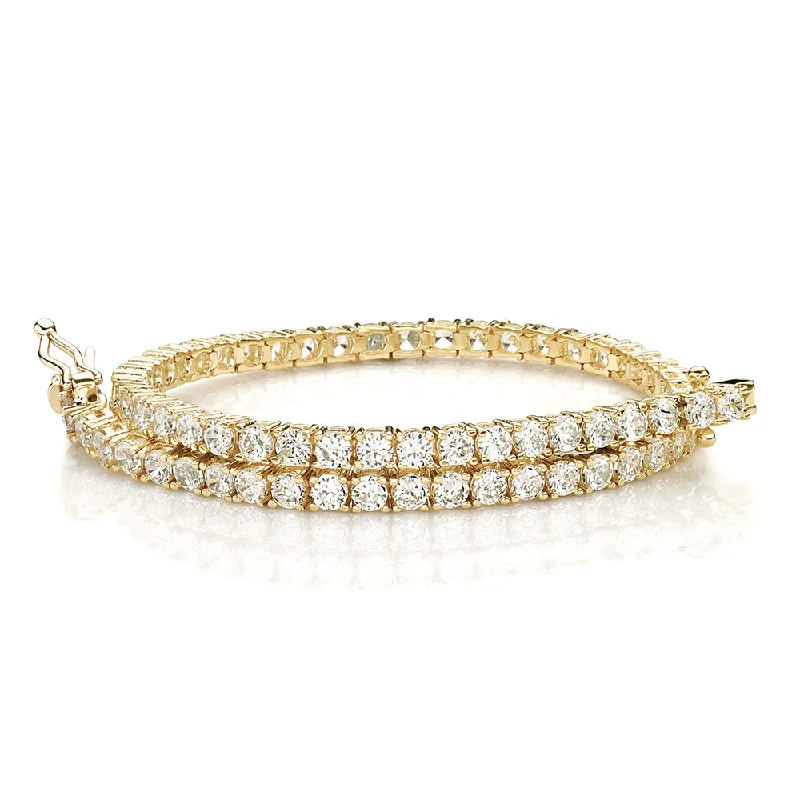 Ladies bracelets with calm charms -Round Brilliant tennis bracelet with 4.02 carats* of diamond simulants in 10 carat yellow gold