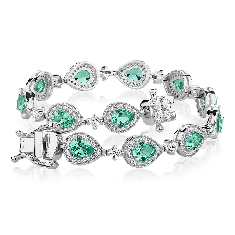 Ladies bracelets for maker elegance -Pear and Round Brilliant tennis bracelet with ocean green simulants and 1.50 carats* of diamond simulants in sterling silver