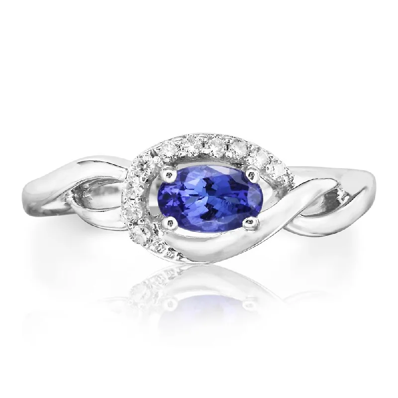 ladies-diamond-channel-set-rings-Oval Tanzanite and Diamond Ring in White Gold by Parle