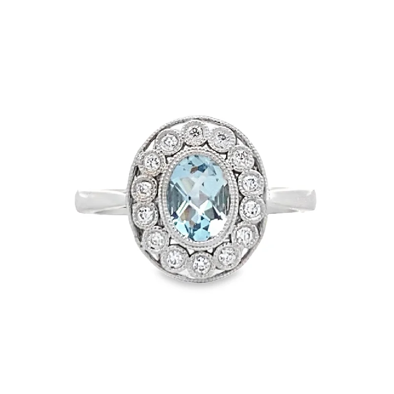 ladies-platinum-channel-set-rings-Aquamarine and Diamond Halo Ring in White Gold by Allison Kaufman