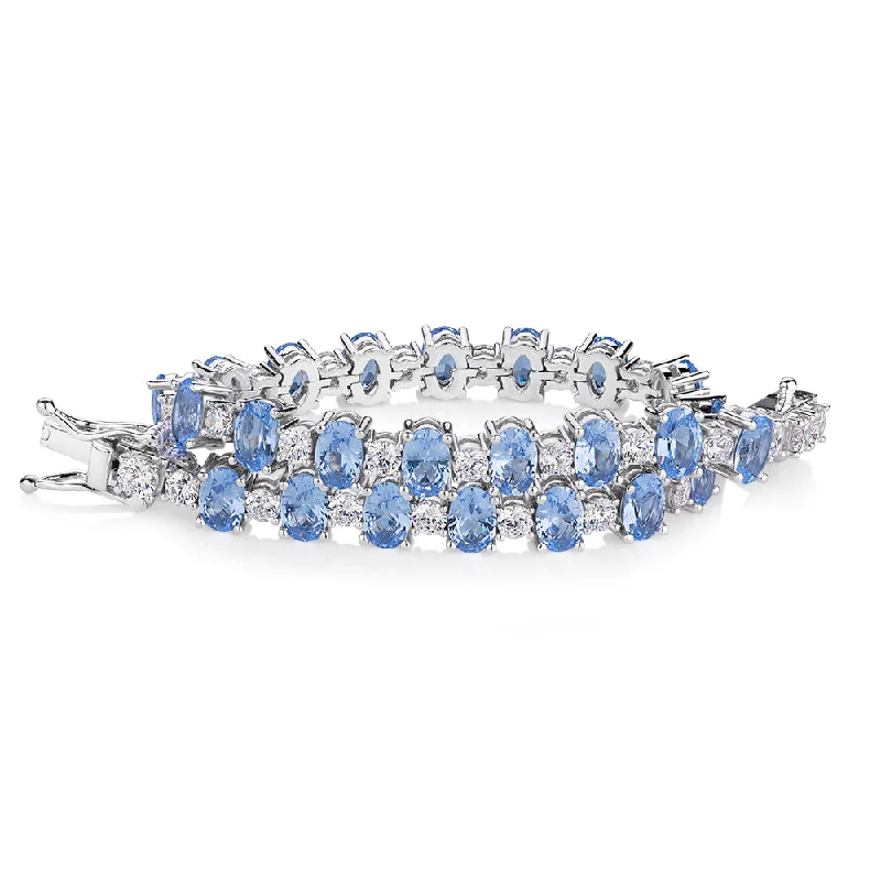 Ladies bracelets for yoga elegance -Oval and Round Brilliant tennis bracelet with blue topaz simulants and 3.26 carats* of diamond simulants in sterling silver